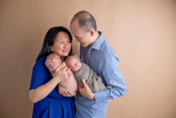 San Diego Newborn Photographer San Diego Newborn Photographer. Parents posing with twins