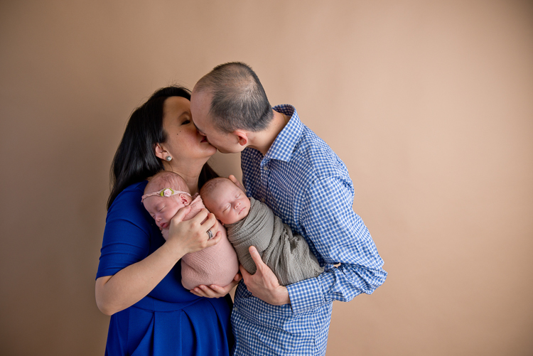 San Diego Newborn photographer San Diego Newborn Photographer. Parents posing with twins