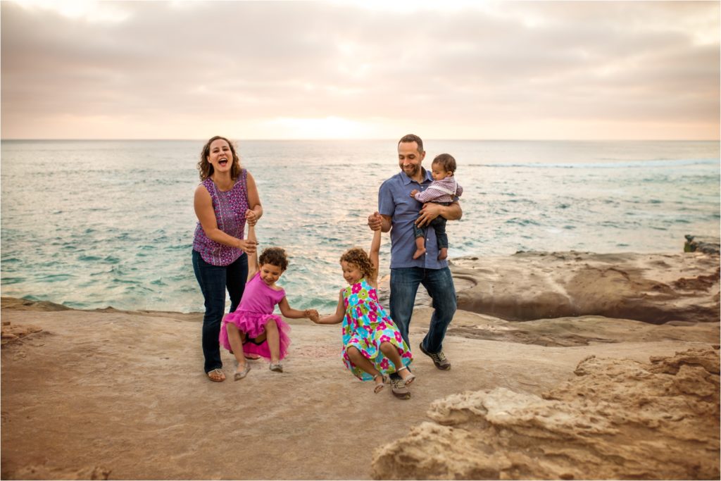 San Diego Family Photographer, Family Portraits San Diego, Windansea Beach, Wind and Sea beach, Family session with three kids. Fun family trick,