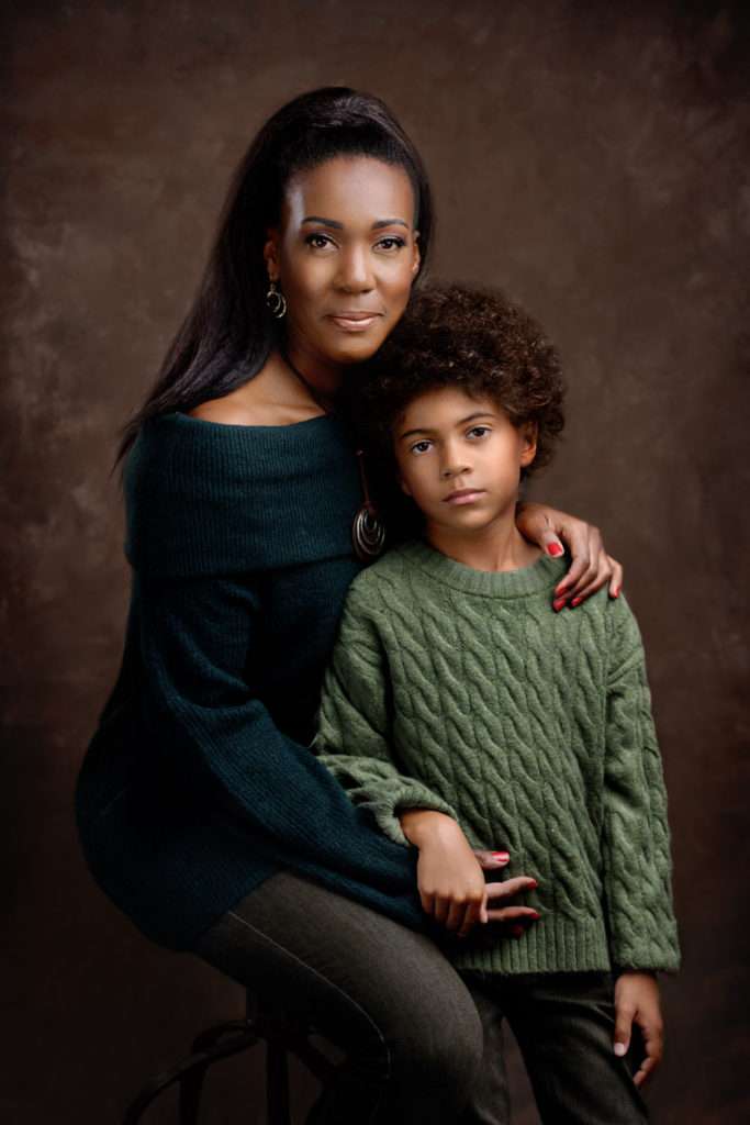 fine art portrait of mother and son wearing green sweaters