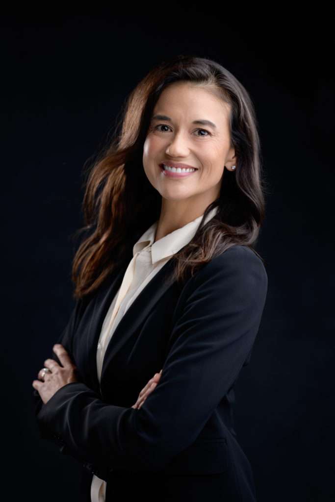 professional headshot of a woman wearing black jacket and white shirt by san diego headshot photographer
