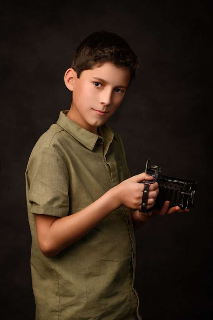 fine art studio portrait of a boy holding camera, san Diego kids portraits, kids pictures, San Diego kids photographer, best childrens photographer